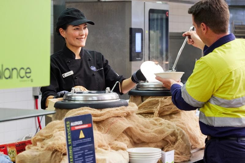 food assistant serving soup I&M industry and manufacturing